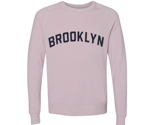Dusty rose Brooklyn crew neck pullover featuring vintage navy lettering and a relaxed classic fit.