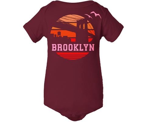 Maroon 100% cotton baby onesie featuring a retro Brooklyn Bridge sunset illustration with unisex fit and snap closures for easy diaper changes.